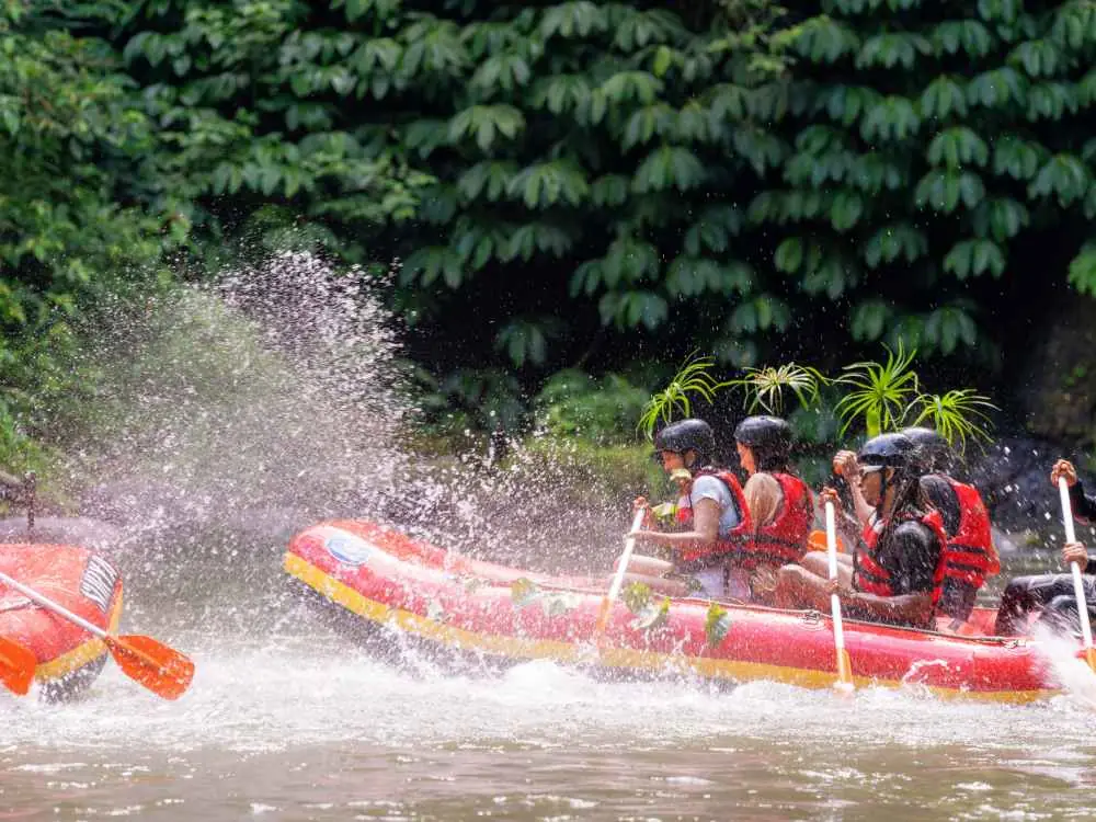 Surya Bintang Adventures guests rafting through Ayung River rapids near Ubud